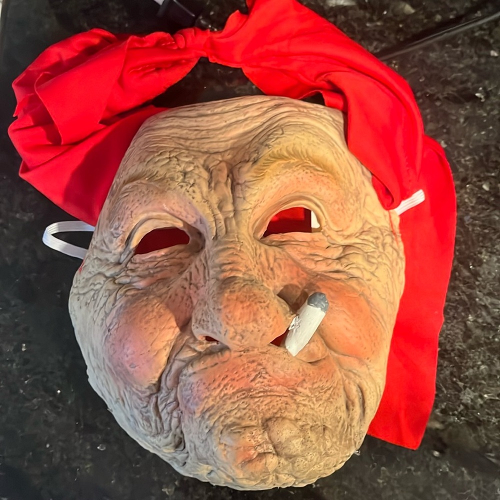 Old lady smoking Halloween mask
